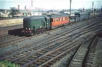 D3730 rattles past Craigentinny westbound on 30 September 1959 with a motley collection of stock, described on the original slide as a <I>maintenance train</I>. [Additional info from David Kerr: This is in fact a tunnel inspection train consisting of an ex Manchester, Sheffield and Lincolnshire Railway Inspection Saloon (for the Engineers), two wagons with elevated platforms (to access the tunnel crown) and a mess van (for the artisan staff). I believe the saloon was later condemned after sustaining derailment damage at Tweedmouth.] <br><br>[A Snapper (Courtesy Bruce McCartney) 30/09/1959]