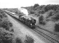 Rebuilt Merchant Navy Pacific no 35028 <I>Clan Line</I> approaching Bicester Station from the south in July 1987<br>
<br><br>[Peter Todd 12/07/1987]