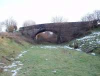 Wennington Junction lies just the other side of this bridge on the old direct line to Lancaster [see image 26998]. It carries the B road from Hornby to Bentham and immediately to its left is another similar bridge that crosses the surviving line to Carnforth. The last train to pass this way was in 1966.  <br><br>[Mark Bartlett 31/12/2009]