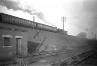Photograph taken looking north east from Dunfermline MPD on 11 February 1959 as 62492 <i>Glen Garvin</i> heads east along the embankment between Dunfermline Upper station and Touch North Junction - possibly hauling a workmen's train, given the non-corridor stock. The locomotive was withdrawn from Thornton Junction shed some 4 months later.<br>
<br><br>[Robin Barbour Collection (Courtesy Bruce McCartney) 11/02/1959]