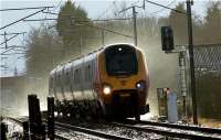 An Edinburgh bound Voyager from Birmingham New Street is seen at speed approaching the foot crossing at the former Brock station on 10 January 2010. Looking through the viewfinder it was possible to see the snow and ice being whipped up by the train, something that has been blamed for several broken windows on passing Pendolinos.<br><br>[John McIntyre 10/01/2010]