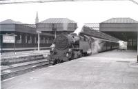 Changes in progress at Paisley Gilmour Street in the late summer of 1966 with cabling troughs and overhead support for electrification in place. From the express headcode and short train, it must be a Wemyss Bay - Glasgow service.<br><br>[Colin Miller //1966]