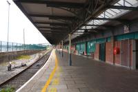 Platform scene at Cobh terminus in May 2008, showing the same view as Bill Roberton's photograph 20 years earlier [see image 20120]. The railings have replaced the brick wall so the area feels more light and open. Unfortunately no trains were running on this occasion as drivers were on strike. 'Irish Railways Then and Now' shows the station was double this size, with another platform on the seaward (left) side and two loop lines running between.<br><br>[Colin Miller 22/05/2008]