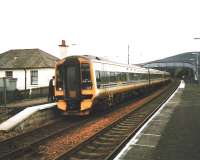 May 1999 and the trolley attendant on an Inverness train seems to be having an intense conversation with an unidentified party on bi-directional platform 1.<br>
<br><br>[David Panton /05/1999]