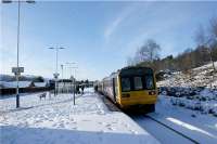 142011 calls at the very wide island platform at Chinley on 23 December 2009 on the 1045 hrs Manchester Piccadilly to Sheffield service. The unit has an out of use Class 150 attached to the rear on a positioning move... or was it for insurance?. <br><br>[John McIntyre 23/12/2009]