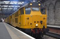 Network Rail yellow 31233, with BR blue 31106 at the other end, sandwich the Measurement Train at Waverley Station on 12 January 2010. The train was about to head west for Bathgate. [See image 27170]<br><br>[Bill Roberton 12/01/2010]