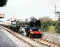 <I>And finally...</I> The last of a long line, BR Standard class 9F 2-10-0 no 92220 <I>Evening Star</I>, running east through Blue Anchor on the West Somerset Railway in March 1989.<br><br>[Peter Todd 19/03/1989]