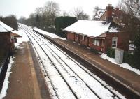 Wilmcote was built in 1907 and many of its GWR features survive, although the station building seen here is in fact a private residence and cannnot be accessed from the platforms. This view from the footbridge is towards Stratford-upon-Avon, the next station and now terminus of the line. <br><br>[Mark Bartlett 12/01/2010]