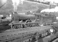 Scott class 4-4-0 no 62435 <I>Norna</I> in the yard at Hawick in November 1957. Withdrawn from Hawick shed at the end of that year the locomotive was cut up at Inverurie Works shortly thereafter.<br><br>[Robin Barbour Collection (Courtesy Bruce McCartney) 23/11/1957]