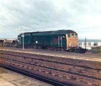 BR Sulzer type 2 24082 at Penmaenmawr ballast terminal in October 1978 awaiting departure towards Chester with a loaded train. <br><br>[David Pesterfield 03/10/1978]