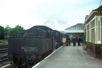 Last chance to send a parcel by rail to Kelso! With <I>Beeching's Bloomer</I> chalked above the buffers of the Standard Class 2 locomotive no 78048, the final (6.35pm) train from Berwick to Kelso and St Boswells is prepared for departure on Saturday 13th June 1964. Latterly just two trains a day in each direction traversed the entire 34 mile branch, supplemented by a further three between Kelso and St Boswells.<br><br>[Frank Spaven Collection (Courtesy David Spaven) 13/06/1964]