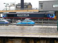 DRS <I>Malcolm Rail</I> liveried 66412 stabled in the sidings at the west end of Cardiff Central station on 23 December 2009. Freightliner later acquired 66412, along with nine other DRS 66s, and in October 2012 it was exported and is now in operation with Freightliner Poland. <br><br>[David Pesterfield 23/12/2009]