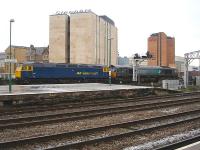 DRS 66415 stands across Penarth Road bridge at the east end of Cardiff Central station in December 2009, in front of stored former <I>Advenza Freight</I> locomotive no 57005. As of December 2012 66415 is working with Freightliner, and 57005 is now with West Coast Rail Co but in store at Carnforth<br><br>[David Pesterfield 23/12/2009]