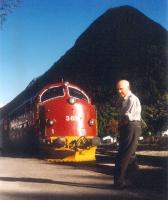 A Swedish-built NOHAB Di3 stands at the branch terminus at Andalsnes, Norway, in 1995. In the foreground, looking a little surprised, is the rarely photographed Frank Spaven, caught taking a break from the viewfinder during what was for him a rail study tour / busman's holiday.<br><br>[David Spaven //1995]