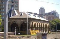 This is the station at Redfern, in Sydney, photographed from a passing train. It was used by the Rookwood Necropolis Railway whence funerals left for the eponymous 'city of the dead' located on a 250 acre site near Haslem's Creek. It ran from 1867 to 1948. [In London, similar services once operated from alongside Waterloo station, serving Brookwood Cemetery and from Kings Cross to the North London Cemetery at New Southgate.]<br><br>[Colin Miller 27/09/2008]