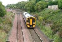 An Edinburgh - Dunblane 158 service, having just left the Edinburgh and Glasgow main line at Polmont Junction (at the bridge in the left background) on 7 August 2007, runs downhill towards its next stop at Falkirk Grahamston. [See image 16130] <br>
<br><br>[John Furnevel 07/08/2007]