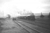 A Black 5 brings a freight north over Beattock summit in the sixties with more than a hint of rain in the overcast sky.<br><br>[Robin Barbour Collection (Courtesy Bruce McCartney) //]