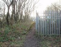 Although Baxenden closed in 1951 trains from Accrington to Bury and Manchester continued to pass through until 1966. An industrial site now occupies the trackbed but, nearly sixty years after the last passengers left, part of the old up platform is still in place. Inside the compound the down platform can also be seen. View south at Map Ref SD 776257.<br><br>[Mark Bartlett 21/01/2010]