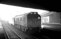 Type 2 diesel no D5131 appears to be trying to hide under Victoria Viaduct at the north end of no 7 bay platform at Carlisle station on 3 January 1969. Lurking behind the locomotive is the stock of the 1pm service for Edinburgh Waverley.<br><br>[K A Gray 03/01/1969]