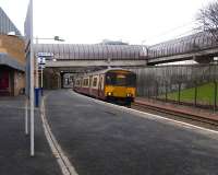 Although there had been a Finnieston station on a different line, the more recent Finnieston was new when the Argyle line opened in 1979.  It did however overlap the site of Stobcross station which had closed when the old Glasgow Central low level line closed in 1964. The new Finnieston was renamed Exhibition Centre after the opening of the venue in 1985. On 20 January 2010, unit 318 250 pulls in heading West and will shortly start climbing the 1979 innovation to Finnieston East Junction where it will join the North Clyde Lines.<br>
<br><br>[David Panton 20/01/2010]