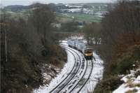 A westbound First TransPennine Express service for Manchester enters the cutting between Chinley East and North Junctions on a dull and cold 29 December 2009. East Junction can just be seen behind the rear coach of unit 185127.<br><br>[John McIntyre 29/12/2009]