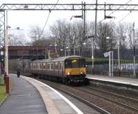 The press got hold of the announcements '...via Yoker not calling at <br>
Yoker' some years ago and made the name briefly famous. Why Yoker was chosen to signify this route is a bit of a mystery as it's the least used station of the five - Jordanhill, Scotstounhill, Garscadden, Yoker and Clydebank - and surely the least recognizable location (forgive me, Yoker). However it is now established. On the cold grey morning of 20 January 318 250 brings in a Dalmuir service with a Lanarkshire origin. <br>
<br><br>[David Panton 20/01/2010]