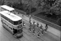 A no 21 tram westbound to Elderslie in Glasgow Road, Paisley in the 1950s. Behind it is a Graham's bus for Hawkhead which will turn right up Kilnside Road.<br><br>[Colin Miller Collection //]