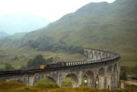 A Class 27 rumbles over Glenfinnan Viaduct with a Fort William-bound train in 1980.<br><br>[Frank Spaven Collection (Courtesy David Spaven) //1980]