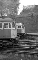 Class 27s at Glasgow Queen Street in March 1974. Nearest the camera a Class 27 leaves on an Edinburgh push pull set while a classmate awaits departure in platform 2.<br><br>[John McIntyre /03/1974]