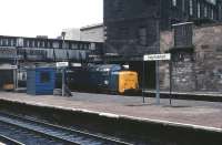 55014 <I>The Duke of Wellington's Regiment</I> at Haymarket in April 1981. Note the various signs of past modifications and enhancements to the station. Nowadays it seems that, whatever it is, if Haymarket hasn't already had one then it'll be getting one, or maybe there's one in progress, or perhaps one in the pipeline. At present (January 2010) various major works are taking place around the station in connection with the new tram interchange. <br>
<br><br>[Peter Todd 22/04/1981]