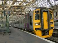 Alphaline liveried 158871 at Platform 3 of Glasgow Central on 14th December 2009. Class 158's are now a regular sight at Glasgow Central as ScotRail has now started using them on the Glasgow Central to Edinburgh services since the start of the December 2009 timetable.<br><br>[Graham Morgan 14/12/2009]