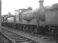 J36 no 65224 <I>Mons</I> is one of a number of locomotives in the holding sidings on the north side of Bathgate yard in January 1964, some 8 months after withdrawal by BR. <br><br>[Robin Barbour Collection (Courtesy Bruce McCartney) 03/01/1964]