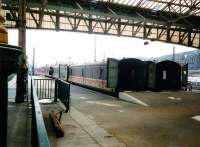 <I>Motorail</I> vans at Waverley in April 1995. The cut-down 'platforms' used by Motorail services had no numbers but were formerly platforms 8 and 9 in the days when as many platforms were needed at the east end of the station as at the west. When platforms were renumbered in December 2006 the old 7 became 4 and 10 became 7, so provision has been made for these platforms to reopen as 5 and 6. At present there isn't a need for them and they are normally used to stable sleeper locomotives [see image 13877].<br><br>[David Panton /04/1995]