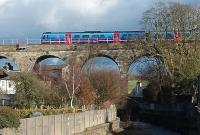 Just to the south of the Oubeck Loops a six arch viaduct carries the WCML across the River Conder and the village of Galgate.  Here, looking east, a Transpennine Unit can be seen as can a small, steel built, trackworkers refuge that is cantilevered to the outside of the bridge and apparently a later addition to the structure.<br><br>[Mark Bartlett 29/01/2010]