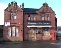 Originally opened by the Garnkirk and Glasgow Railway in 1842, Coatbridge Central was rebuilt by the Caledonian in 1899. The old building has had its ups and downs in recent years but is currently on a definite down, following its closure after a short run as a pub. The CR initials and 1899 date are still prominent above the windows on the upper level. [See image 3904]<br><br>[Andy Furnevel 02/02/2010]