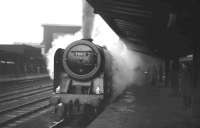 Kingmoor Britannia Pacific no 70013 <I>Oliver Cromwell</I> about to take a southbound football special out of Carlisle bound for Blackpool on Boxing Day 1967. The locomotive was officially withdrawn by BR the following year and is now preserved. (Robin Barbour is standing on the right of the picture) <br>
<br><br>[K A Gray 26/12/1967]