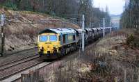 A southbound loaded freightliner passes the site of Auchencastle station. This was braking hard for a pause at Beattock - the hot smell from the brakes was quite something.<br><br>[Ewan Crawford 28/01/2010]