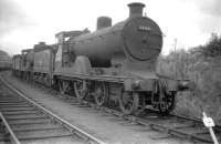 Pickersgill ex-Caledonian 4-4-0 no 54461 stands with other stored locomotives in a siding at Carstairs in the summer of 1959, some 3 months after official withdrawal from 64D. Disposal took place via Motherwell Machinery & Scrap, Wishaw, the following February.<br><br>[Robin Barbour Collection (Courtesy Bruce McCartney) 29/07/1959]