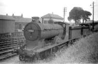 Reid D30 <I>'Scott'</I> class 4-4-0 no 62421 <I>'Laird o' Monkbarns'</I> stored in a siding at the east end of Polmont shed yard on 27 July 1959. Polmont Junction signal box stands in the background on the other side of the E&G main line. The D30 was <I>officially</I> withdrawn from St Margarets almost a year later in June 1960 and cut up at Cowlairs Works the following August. [See image 37914]<br><br>[Robin Barbour Collection (Courtesy Bruce McCartney) 27/07/1959]