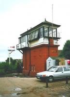 The signal box at Dyce seen from trackbed of Buchan line in July 1998. Note the oddly-opening windows.<br><br>[David Panton /07/1998]