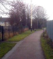 The Milton Keynes Railway Walk isn't as bad as it sounds; it is tarmacked and street lit, and follows the former branch from Wolverton to Newport Pagnell; which was closed while MK was in the planning stages. A shame - they could have had a very neat self-contained light railway operation. Newport Pagnell's former distant signal post stands aloof, some 46 years after closure; the cleared station site is behind the camera.<br><br>[Ken Strachan 22/01/2010]