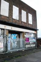 The frontage of the closed Longbridge (2nd) station which was within the Longbridge Plant. Regrettably some of the letters have fallen off in the past few years - all that remains is 'TickEts parcels' where the missing letters can still be seen pristine white against the grime. The station was below street level.<br><br>[Ewan Crawford 29/01/2010]