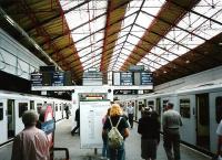 The eastbound District Line platforms 1 and 2 at Earl's Court in July 1994. Note the antiquated train departure indicators.<br><br>[David Panton 14/07/1994]