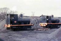 The power station sidings in Lancaster were on either side of the Lancaster Canal embankment seen in the background and connected via a line under the aqueduct as in image 23412. Here, on the north side of the canal amid a pile of ash, are Barclay 0-6-0F <I>Lancaster</I> 1572/1917 and Barclay 0-4-0F 1950/1928. The smaller fireless loco worked here from 1966 until closure in 1981 and then shunted flask wagons at Heysham nuclear power station but that work is now carried out by a Sentinel diesel locomotive. It is now preserved at the Ribble Steam Railway [See image 27587]. <br><br>[David Hindle //1968]