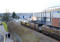 The future of Bristol looks on as Freightliner 66560 passes Ashton Gate on the Portishead branch with a loaded coal train from Portbury import terminal on the morning of 9 February 2010. The probable destination in this case is Rugeley power station.<br><br>[Peter Todd 09/02/2010]