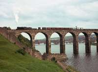 A northbound freight drifts off the Royal Border Bridge in the summer of 1964. The photographer's great-great-grandfather was a stonemason who helped to build the bridge between 1847 and 1850.<br><br>[Frank Spaven Collection (Courtesy David Spaven) //1964]