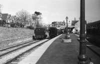 Looking towards the buffer stops at Swanage station as a loco runs around its train in May 1984.<br><br>[John McIntyre /05/1984]