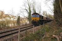 Coal empties heading back to Portbury coal import terminal run west alongside the Avon on 9 February, photographed passing Rownham.<br><br>[Andy Kirkham 09/02/2010]