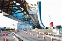 The Port Eglinton Viaduct of the M74 extension looms over Kilbirnie Street. Eglinton Street station was directly below the street here and the parapets of the bridge over the West Coast Main Line can be seen on either side.<br><br>[Ewan Crawford 11/02/2010]