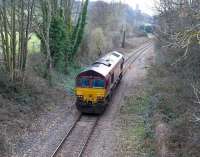 EWS 66016 heads west light engine towards Portbury import terminal on 9 February 2010. The south tower of Brunel's Clifton suspension bridge stands on the horizon.<br><br>[Peter Todd 09/02/2010]